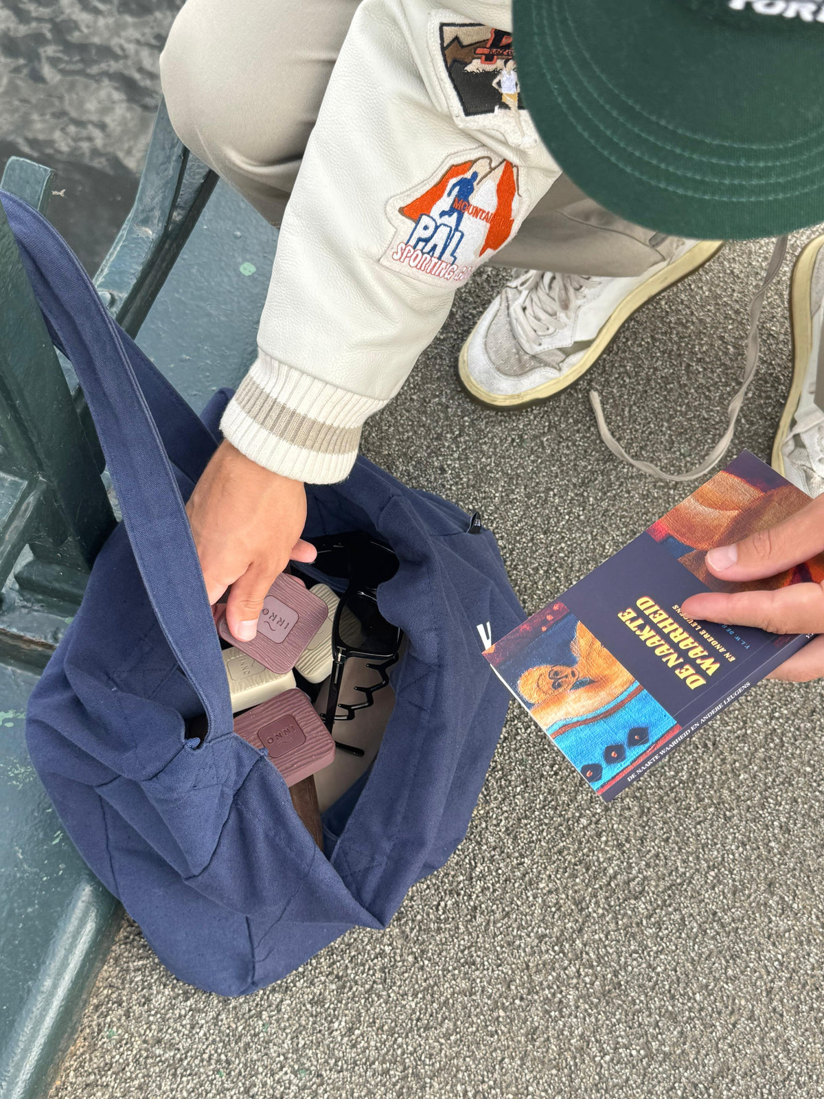 Kiuas blocks and sunglasses in a navy canvas tote